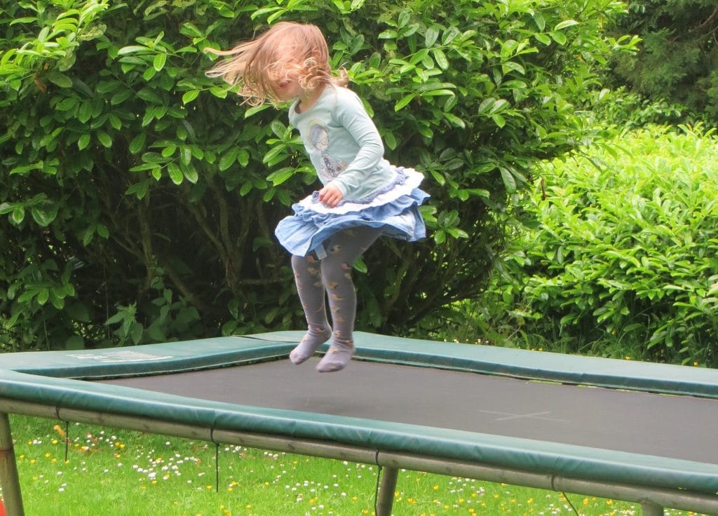 a girl bouncing on one of the best rectangular trampolines
