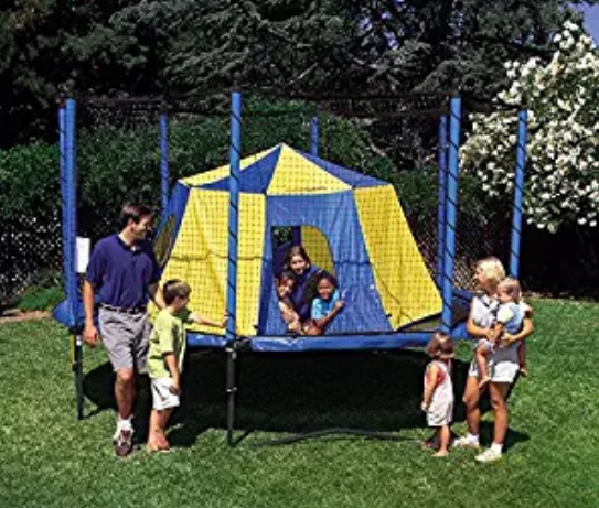 kids and their parents by the blue and yellow trampoline