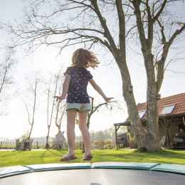 girl jumping on the trampoline